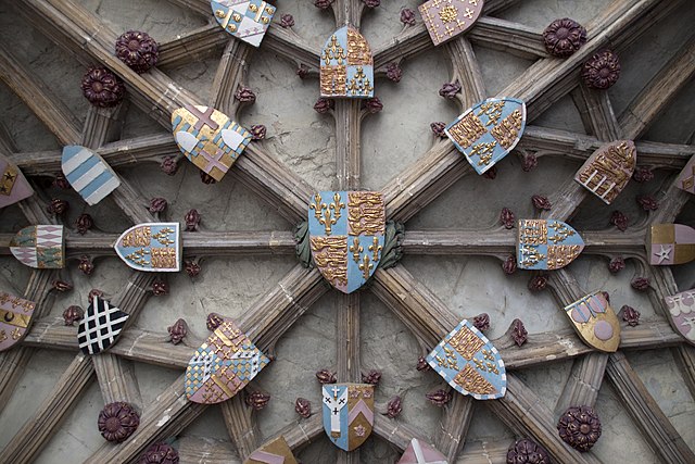 Ceiling of entrance of Canterbury Cathedral showing the king's arms in centre surrounded by 8 shields: 5 royal princes and dukes, the arms of Mortimer