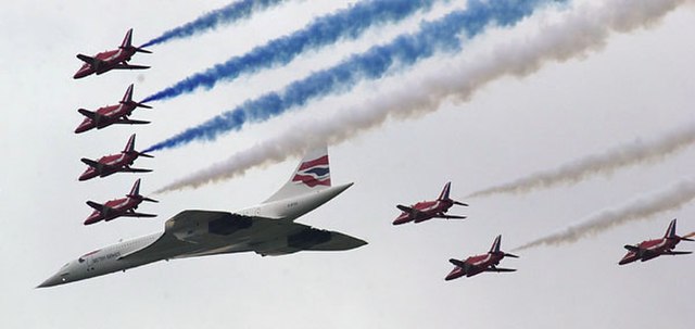 The Red Arrows and Concorde conclude a special flypast over Buckingham Palace, London, on 4 June 2002 celebrating the Queen's Golden Jubilee