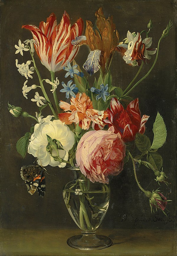 Flowers in a glass vase with a red admiral butterfly