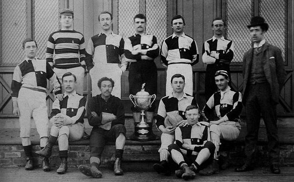 The 1887 team posing with the Cleveland Challenge Cup