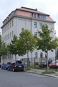 Apartment building in formerly half-open development