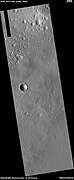 Wide view of expanded craters, as seen by HiRISE After the impact, ice left the ground and made the crater larger in diameter.