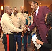 Earl Lloyd (right) was the first African American to play in the NBA in 1950. Earl Lloyd - CIAA HOF Brunch - 1-3-06.jpg