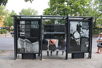 Display on bus stop at the former site of Adolf Eichmann's office in Berlin on Kurfurstenstrasse 115 (now occupied by a hotel building). After the foundation of the RSHA in September 1939, Eichmann became director of RSHA sub-section (Referat) IV D 4 (Clearing Activities, or Räumungsangelegenheiten) (1940), and, after March 1941, IV B 4 (Jewish Affairs, or Judenreferat). Both offices organized the deportation of Jews. From this position, Eichmann played a central role in the deportation of over 1.5 million Jews from all over Europe to Nazi killing centers.[34]