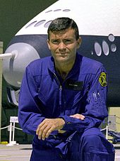 Haise in front of the Space Shuttle Enterprise in 1976