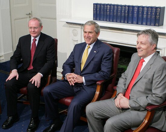 Robinson with George W. Bush (centre) and Martin McGuinness (left)