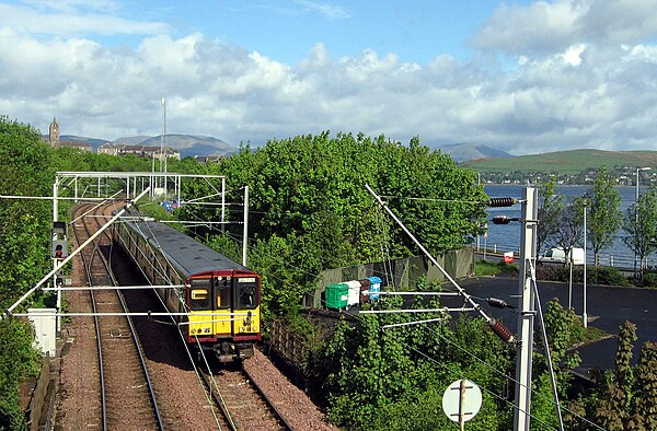 A Class 314 train leaves Gourock pierhead to run along the south bank of the Firth of Clyde towards Glasgow