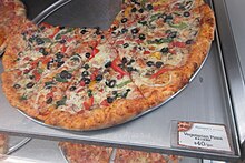 Pizza by the slice at a sidewalk food shop in Hong Kong HK TST Jia Lian Wei Lao Dao Granville Road Burlington Arcade sidewalk shop food Paisano's Pizzer big round pizzas June 2017 IX1 01.jpg