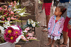 A girl in front of a flower shop. Havana (La Habana), Cuba