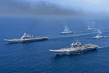Indian aircraft carriers INS Vikramaditya and INS Vikrant with the carrier battle group sailing together INS Vikrant (R11) and INS Vikramaditya (R33) with the carrier battle group.jpg