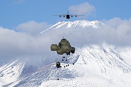 Japan Ground Self-Defense Force's heavy containerized delivery system bundles drop from a U.S. Air Force C-130J Super Hercules assigned to the 36th Airlift Squadron.jpg