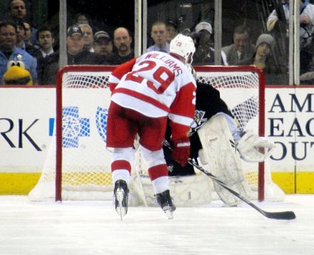 Jason Williams of the Detroit Red Wings attempting a shootout shot on Marc-André Fleury.