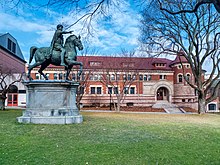 Lyman Hall, built 1890-92, houses the Department of Theatre Arts and Performance Studies Marcus Aurelius statue and Lyman Hall at Brown University.jpg