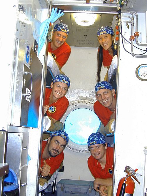 NEEMO 5 crew members are pictured in the bunkroom aboard the Aquarius research habitat. Top, L–R: Reisman, Hwang; Middle: Whitson, Anderson; Bottom: T