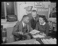 New York Post journalist Ted Poston working at the Office of War Information with his assistants William Clark and Harriette Easterlin.jpg