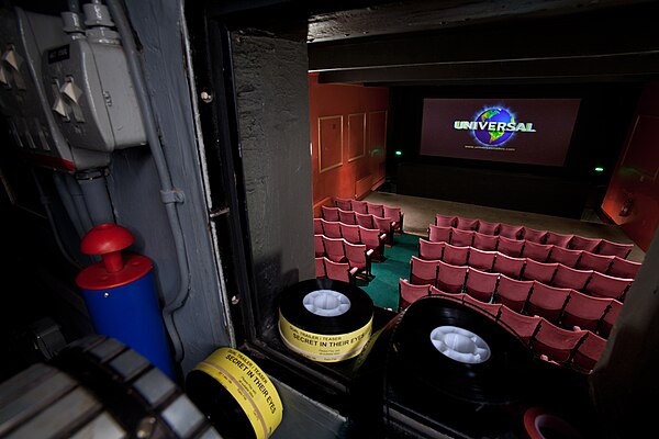 The view from the projectionist's booth at Ultimate Palace Cinema in Oxford. The projector is displaying the 1997–2012 Universal Pictures logo.