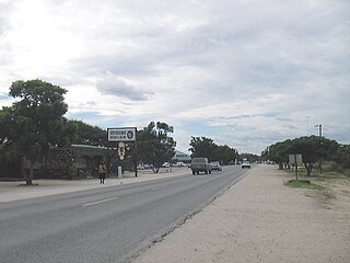 Ozzys Beerhouse and Eugen Kakukuru Street in Rundu, Namibia, March 2006.jpg