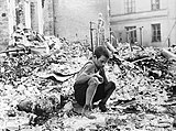 September: Siege of Warsaw. Polish kid in the ruins of Warsaw September 1939.jpg