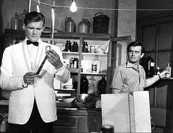 Roger Moore (left) with Earl Green in The Saint