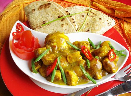 The regional version of chicken masala, served with roti, is one of the most popular dishes in the country.