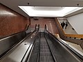 Escalators and stairs leading from the plaza level to the lobby level (left) and mall (right)