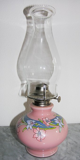 Swiss flat-wick kerosene lamp. The knob protruding to the right adjusts the wick, and hence the flame size.