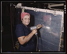 The Library of Congress - Operating a hand drill at Vultee-Nashville, woman is working on a "Vengeance" dive bomber, Tennessee (LOC).jpg