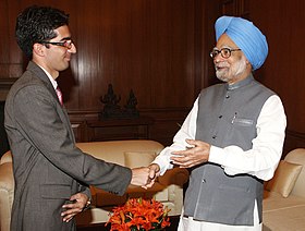 The Prime Minister, Dr. Manmohan Singh congratulating Dr. Shah Faisal, the Civil Services topper for 2010 from Jammu & Kashmir, in New Delhi on May 26, 2010.jpg