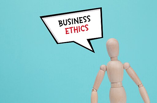 A wooden man and white cloud with text BUSINESS ETHICS trends for ethical consumerism.
