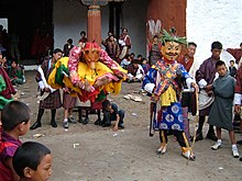 Masked dancers (hero and leaping dog) at the Wangdue Phodrang tshechu, Bhutan, 2007. Tsechu cham.jpg