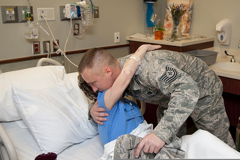 File:U.S. Air Force Tech. Sgt. Drew Stanley embraces Sandra Adams in her room at Integris Southwest Medical Center in Moore, Okla., May 23, 2013 130523-Z-ZW424-054.jpg