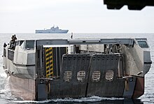 US Navy 120207-N-YF306-086 A French landing catamaran (L-CAT) pulls into the well deck of the amphibious assault ship USS WASP (LHD 1).jpg