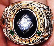 A class of 2012 ring, "For More Than Ourselves". West Point 2012 Ring.JPG