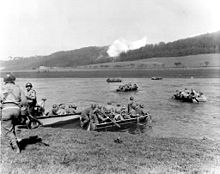 From newly captured town, members of the 16th Infantry Regiment, 1st Infantry Division, cross the Weser River in assault boats to take Furstenberg. 8 April 1945. 1st Infantry Division, crossing the Weser River.jpg