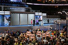 A group of delegates on the convention floor hold up signs in protest of the Trans-Pacific Partnership. 2016 DNC convention floor.jpg