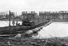 Tanks of the 2nd Armored Division cross the Roer into Juelich on a ponton bridge. 2d Armored Division tanks cross the Roer into Juelich.png