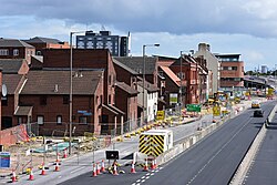 Houses along Castle Street, Kingston upon Hull, during extensive roadworks. As recently as a few weeks ago, traffic would travel a few paces from their doors - recent road realignment means the bulk of the roadworks are now taking place at their doorstep.