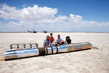 The recovering team poses for a photo with the payload before loading the instrument into a pair of U.S. Army helicopters and returning to base. A photo with the payload before loading the instrument in a pair of U.S. Army Helicopters.jpg