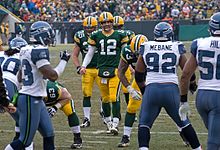 Packers quarterback Aaron Rodgers (#12) lining up against Seahawks defensive tackle Brandon Mebane (#92) during a 2009 regular season game