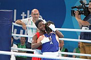 Deutsch: Boxen bei den Olympischen Jugendspielen 2018 Tag 12, 18. Oktober 2018 - Finale Fliegengewicht Mädchen – Martina La Piana (Italien, blau) schlägt Adijat Gbadamosi (Nigeria, rot) 5-0; Ringrichter ist James Beckles (Trinidad und Tobago). English: Boxing at the 2018 Summer Youth Olympics on 18 October 2018 – Girl's flyweight Gold Medal Bout - Martina La Piana (Italy, blue) beats Adijat Gbadamosi (Nigeria, red) 5-0; Referee is James Beckles (Trinidad and Tobago). Español: Boxeo en los Juegos Olímpicos Juveniles de Verano de 2018 en 18 de octubre de 2018 - Combate a medalla de oro de peso mosca para mujeres: Martina La Piana (Italia, azul) le gana a Adijat Gbadamosi (Nigeria, roja) 5-0; El árbitro es James Beckles (Trinidad y Tobago).