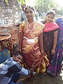 Bride wore the Gondhu and has tied White towel around her waist which were sent by the Groom's family.