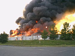 Building 7 burns to the ground as part of a fire department training exercise. Building 7 fire.jpg