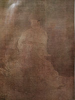 A deity in three-quarter view dressed in a robe.