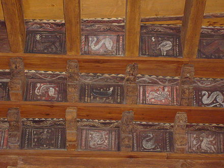 The 14th-century ceiling of the cloister of Fréjus Cathedral is decorated with paintings of animals, people and mythical creatures