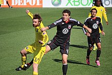 Gaven competes for a header with Marc Burch during a 2011 regular season match at Columbus Crew Stadium Gaven-burch.jpg