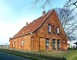 The schoolhouse from 1871 is a listed building