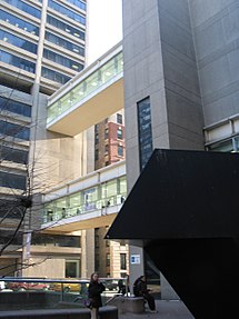 View of the bridges between the East and West Buildings, the subway entrance, and Tony Smith's Tau Hunter College bridge.jpg