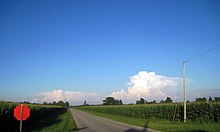 Looking east from Inlet on County Road N. Shadow of the Inlet Mennonite Church's steeple can be seen at the bottom. Inlet, looking east down County Road 16.JPG