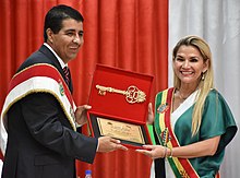 Then Bolivian President Jeanine Anez receives the key to the city of Reyes. Jeanine Anez at the 314th Anniversary of Reyes. 6 January 2020, Ministry of Communication, Reyes (51907629988).jpg