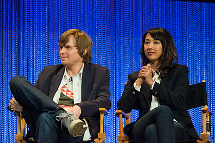 Jed Whedon and Maurissa Tancharoen sitting.